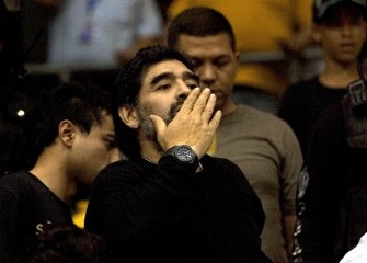 Diego Maradona greets fans during a visit to Caracas, Venezuela on July 21, 2010. AFP PHOTO