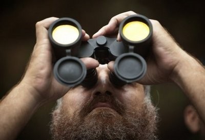 A Pakistani police commando watches rescue operations in the Margala Hills close to Islamabad on July 28, 2010. AFP