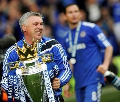 Chelsea's Italian manager Carlo Ancelotti celebrates with the Barclays Premier League trophy after Chelsea won the title at Stamford Bridge, West London, England, on May 9.