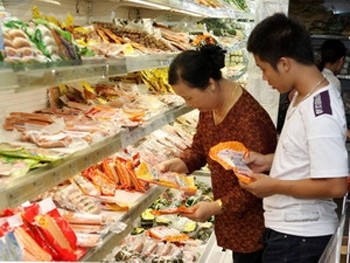 Customers choose food at a supermarket in HCMC
