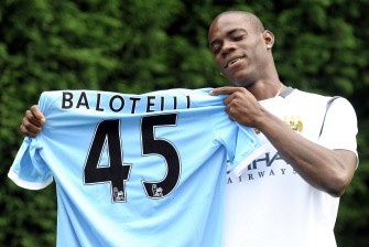 Mario Balotelli poses for photographers at Manchester City's Carrington training complex on August 17, 2010. AFP