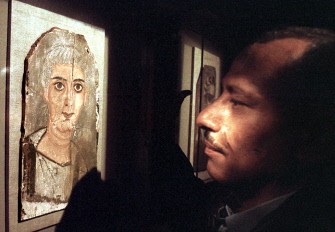 AFP FILES--An Egyptian looks on March 03 1998, at one of the 30 so-called Fayyum portraits on display at the Mahmoud Khalil Museum of Modern Art in Cairo. AFP