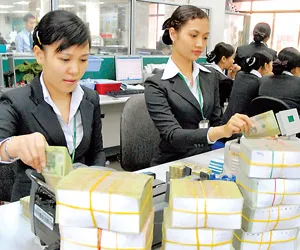 NHNN đã chủ động tăng lượng tiền cung ứng thông qua điều hành linh hoạt nghiệp vụ thị trường mở, tăng khối lượng cho vay tái cấp vốn. Ảnh: CAO THĂNG