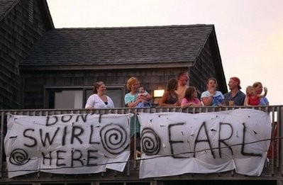 Holidaymakers stand on the balcony of a rented beach house in Avon, North Carolina. AFP