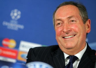 (AFP FILES) A picture taken on November 20, 2006, shows Olympique Lyonnais' coach Gerard Houllier smiling during a press conference at Santiago Bernabeu stadium in Madrid.