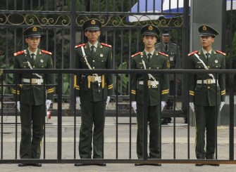 Chinese paramilitary policemen keep watch outside the Japanese embassy in Beijing on September 20, 2010. AFP
