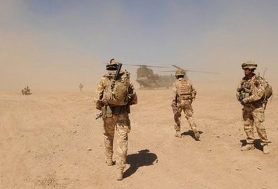 British soldiers walk towards a military helicopter during a patrol of Afghanistan's Helmand province in March 2010