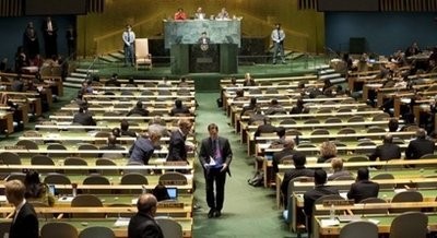 Diplomats from the the Swedish delegation walk out as Iranian President Mahmoud Ahmadinejad (background) addresses the 65th session of the General Assembly at the United Nations in New York. AFP
