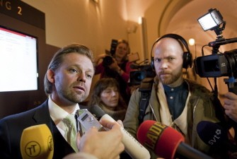Wikileaks founder Julian Assange's lawyer Bjorn Hurtig (L) meets the media after an international arrest warrant was issued against Assange, in a rape investigation, at a District Court in Stockholm, on November 18, 2010. AFP