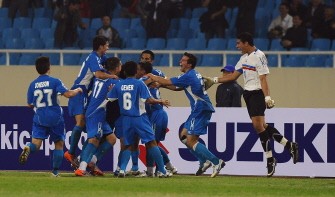 Philippines players celebrate after equalizing against Singapore. AFP