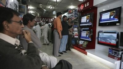 People watch Wikileaks memos at an electronic shop in Karachi, Pakistan on Thursday, Dec. 2, 2010.