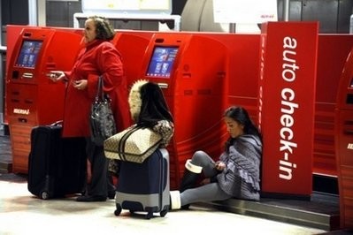Commuters wait for flights at Madrid's Bajaras airport.