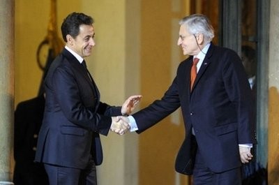 French President Nicolas Sarkozy (L) shakes hands with European Central Bank head Jean-Claude Trichet after their meeting at the Elysee Palace in Paris.