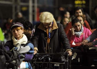 Passenger queue as they wait for a flight at Madrid's Barajas airport on December 4, 2010 after flights were cancelled due to a massive walkout of air traffic controllers in Barajas. AFP