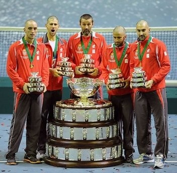 Serbian Davis Cup squad members hold up the Davis Cup after winning the last singles Davis Cup tennis match finals between Serbia and France, at Belgrade Arena. (AFP)