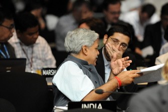 Representatives of India go through documents during the COP16 United Nations Climate Change conference on December 10, 2010 in Cancun, Mexico. AFP