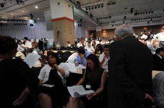 Envoys from more than 190 nations look through documents during the COP16 United Nations Climate Change conference on December 10, 2010 in Cancun, Mexico. AFP