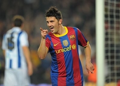 Barcelona's forward David Villa celebrates after scoring a goal during their Spanish League football match FC Barcelona vs Real Sociedad at Camp Nou stadium in Barcelona. Barca won 5-0.