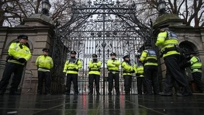 Irish police guard the front gate of the Irish Parliament building (Dail) in Dublin, Ireland, on December 7, 2010.