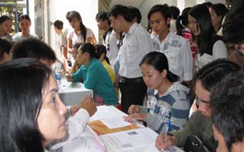 File photo shows laid-off workers register for unemployment allowance at an unemployment pay centre.