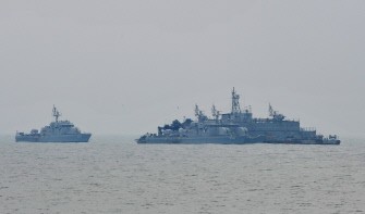 A South Korean Navy vessel berths at a Movement Sea Base (MSB) off the South Korea-controlled island of Yeonpyeong near the disputed waters of the Yellow Sea on December 17, 2010.