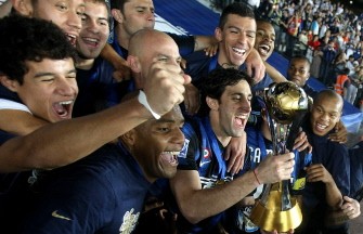Inter Milan's players celebrate with the trophy. AFP