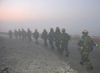 South Korean marines patrol on the South Korea-controlled island of Yeonpyeong near the disputed waters of the Yellow Sea on December 20, 2010. AFP
