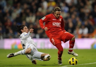 Real Madrid's defender Sergio Ramos (L) vies with Sevilla's midfielder Diego Capel (R) during the Spanish league football match Real Madrid CF vs Sevilla FC on December 19, 2010. AFP