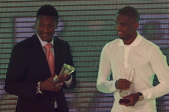 Samuel Eto'o (R) poses with Ghana’s footballer Asamoah Gyan (L) during the annual CAF awards ceremony in Cairo on December 20, 2010. AFP