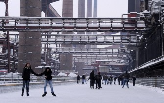 People skate on a rink in the western German city of Essen on December 21, 2010. AFP