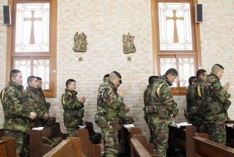 AFP files - South Korean marines pray during a Christmas mass at a Catholic church in Yeonpyeong island on December 25, 2010.