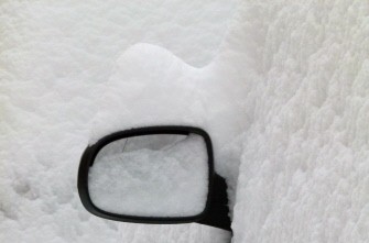 A mirror is all that can be seen of a snow-covered car road near the eastern German city of Weimar on December 25, 2010 as wintery weather conditions continue to make traveling difficult in many parts of Europe. AFP