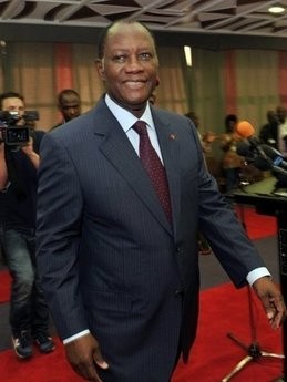 Ivory Coast's internationally recognised leader Alassane Ouattara smiles after giving a press conference at the Golf Hotel in Abidjan on December 24