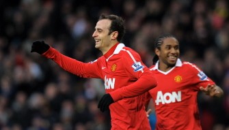 Manchester United's Bulgarian striker Dimitar Berbatov (L) celebrates after scoring his first goal during the English Premier League football match between Manchester United and Sunderland at Old Trafford in Manchester on December 26, 2010. AFP