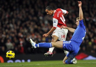 Arsenal striker Theo Walcott (L) scores the third goal. AFP
