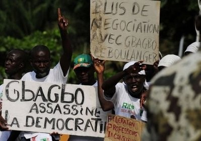 AFP - Supporters of Ivory Coast's internationally recognised leader Alassane Ouattara demonstrate on December 28, 2010 at the Golf Hotel in Abidjan.