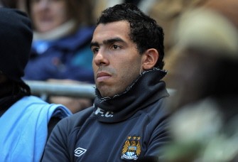 Manchester City's Argentinian striker Carlos Tevez sits on the substitute's bench before the English Premier League football match between Manchester City and Aston Villa. AFP