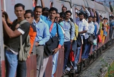 Commuters travel by train in Mumbai. India is on course to top China as the world's most populous country in 2025