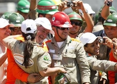Brazil's President Luiz Inacio Lula da Silva (3rdL) is greeted by workers during the launching ceremony of Petrobras' Transpetro oil tanker Sergio Buarque de Holanda in November 2010.