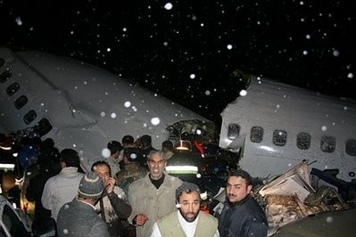 Rescuers work near the wreckage of a state-run Iran Air Boeing 727 airliner near the northwestern city of Orumiyeh in the West Azerbaijan province