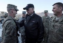 AFP file - US Vice President Joe Biden (C) talks with a US soldier as US General David Petraeus (2nd L) looks on at a US base in Maidan Shar Wardak province.