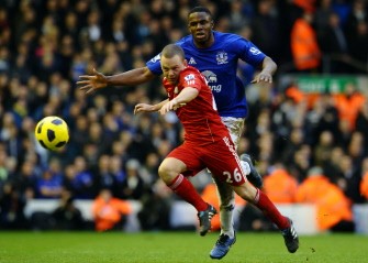 Liverpool's Jay Spearing vies with Everton's Victor Anichebe (back) during their match at Anfield in Liverpool on January 16, 2011. AFP