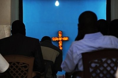 Members of a Christian congregation listen to the Sunday sermon during mass at a church in the southern Sudanese capital Juba.