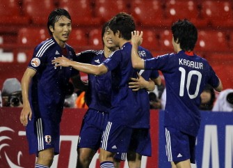 Japanese players celebrate after scoring a goal against Saudi Arabia during their 2011 Asian Cup group B football match at Al-Rayyan Stadium in the Qatari capital Doha on January 17, 2011.