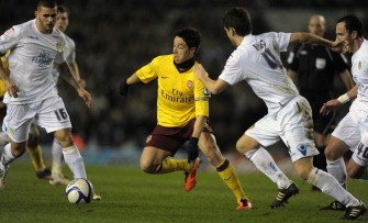 Arsenal's Samir Nasri (C) vies with the Leeds defenders during the FA Cup match at Elland Road on January 19, 2011. AFP