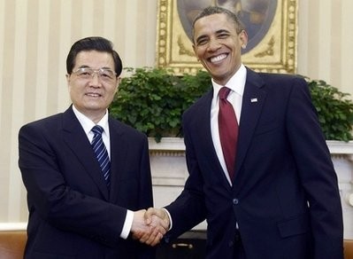 US President Barack Obama (R) shakes hands with his Chinese counterpart Hu Jintao before a bilateral meeting in the Oval Office at the White House in Washington, DC.