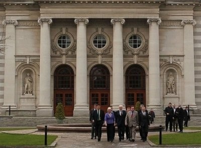 AFP - Ireland's Green party walks out of the government buildings after announcing that they can no longer continue in Government in Dublin, Ireland.