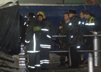 Resquers evacuate a dead body of a victim at Moscow's Domodedovo International Airport on January 25, 2011. AFP