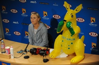 Caroline Wozniacki of Denmark speaks during a press conference next to an inflatable kangaroo and a pair of boxing gloves on the desk after she beat Francesca Shiavone. AFP