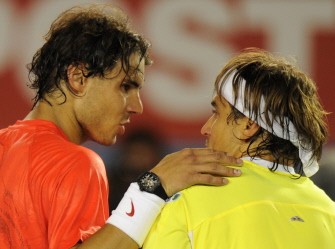 Rafael Nadal (L) places his hands on match winner David Ferrer on January 26, 2011. Ferrer won 6-4, 6-2, 6-3. AFP